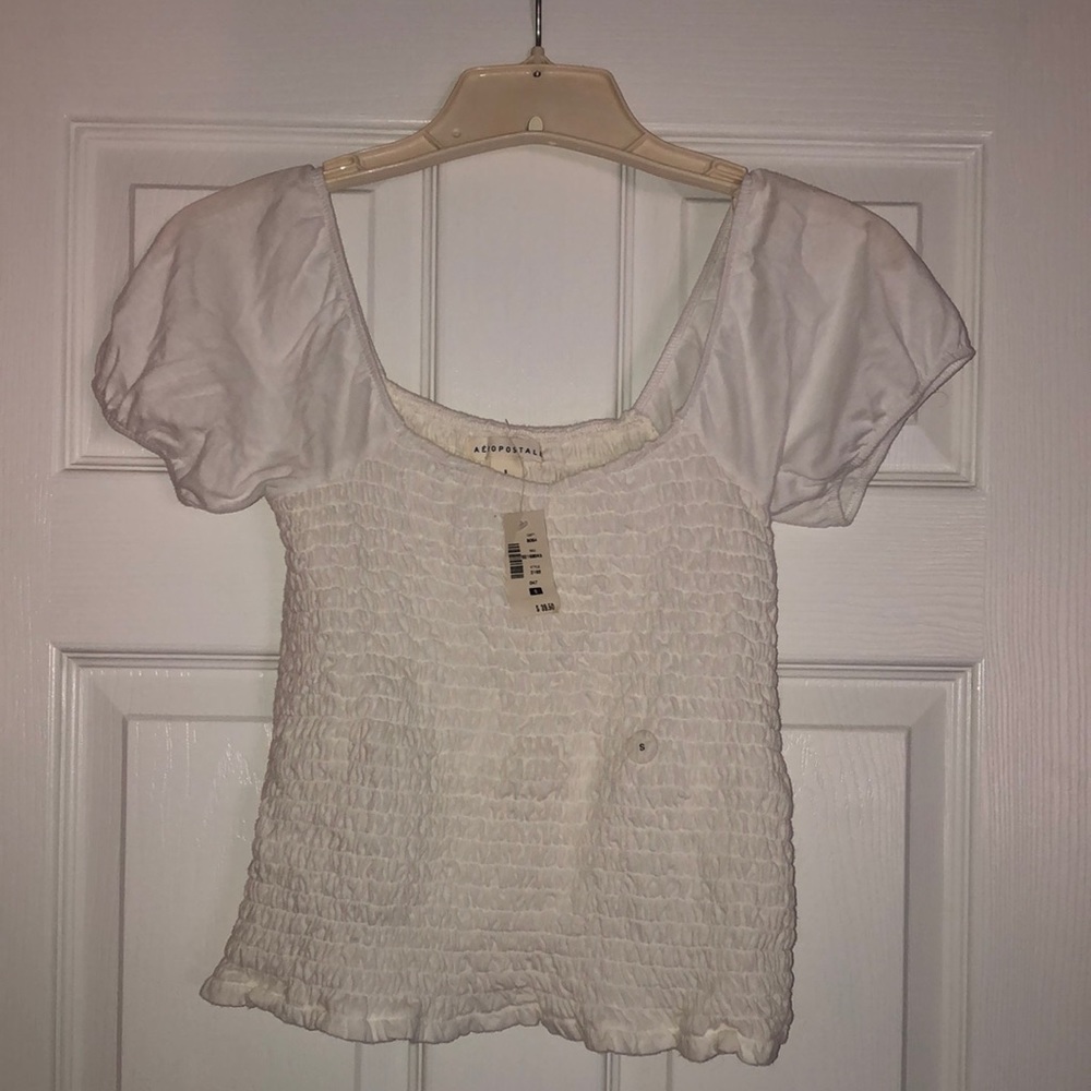 Adorable white smocked top !